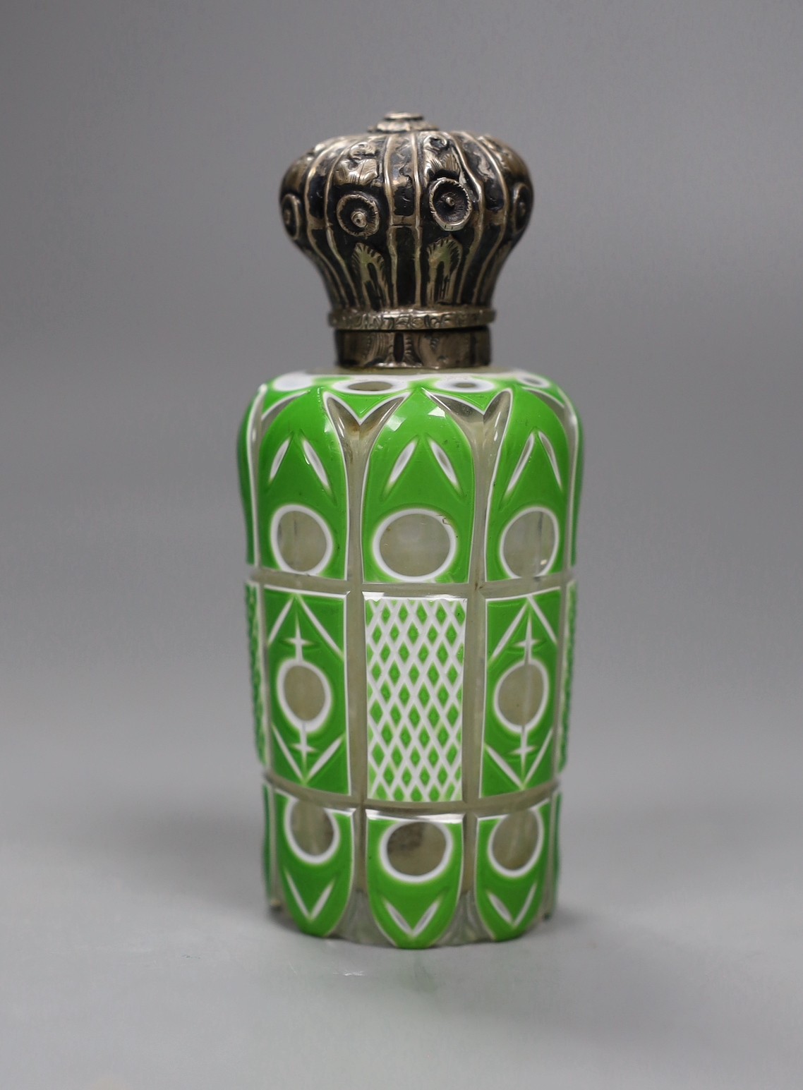 A Victorian silver mounted green and white overlaid glass scent bottle, 10cms high